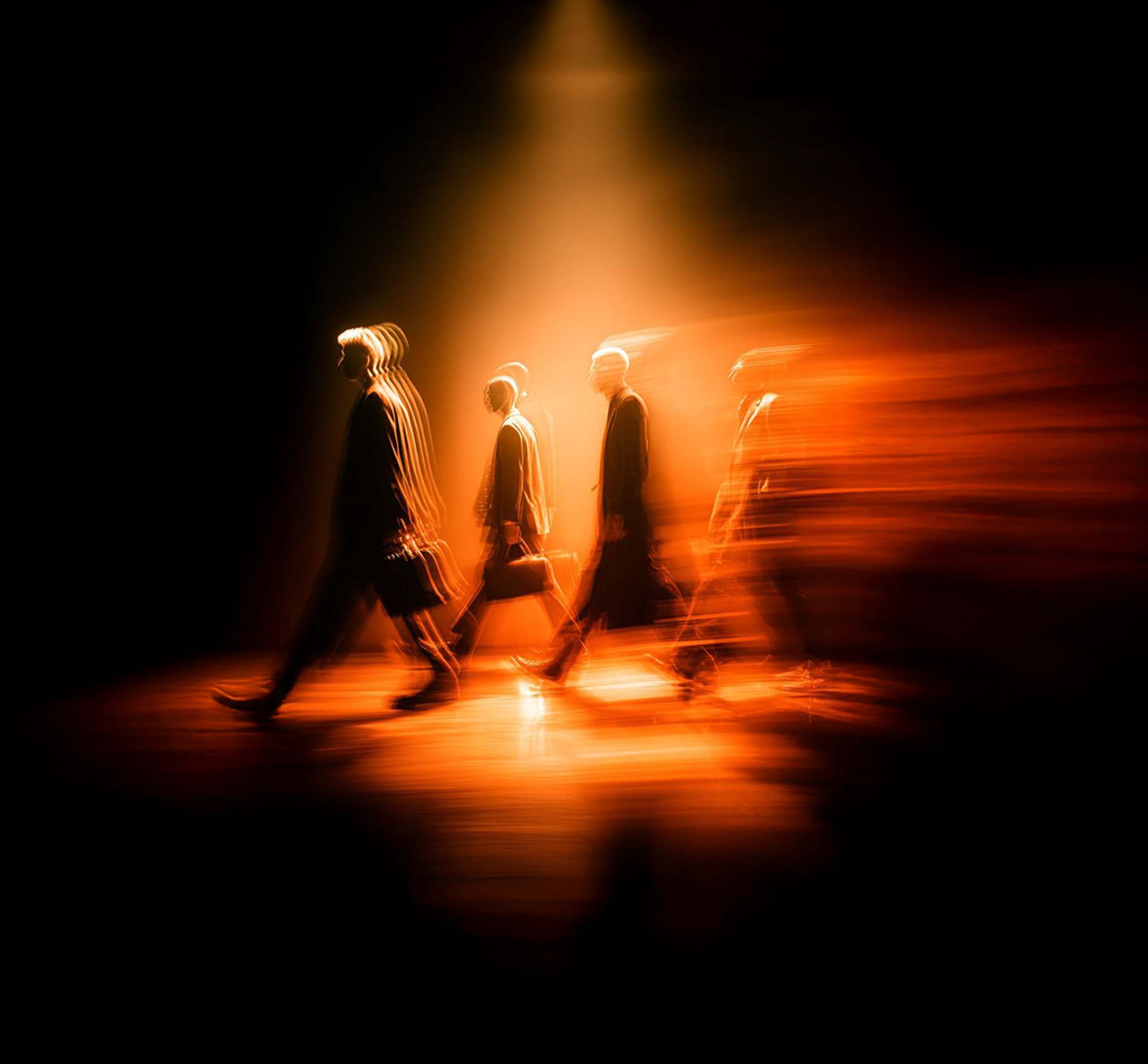 Business professionals in motion symbolizing teamwork, agility, innovation and forward-thinking creative and marketing solutions.