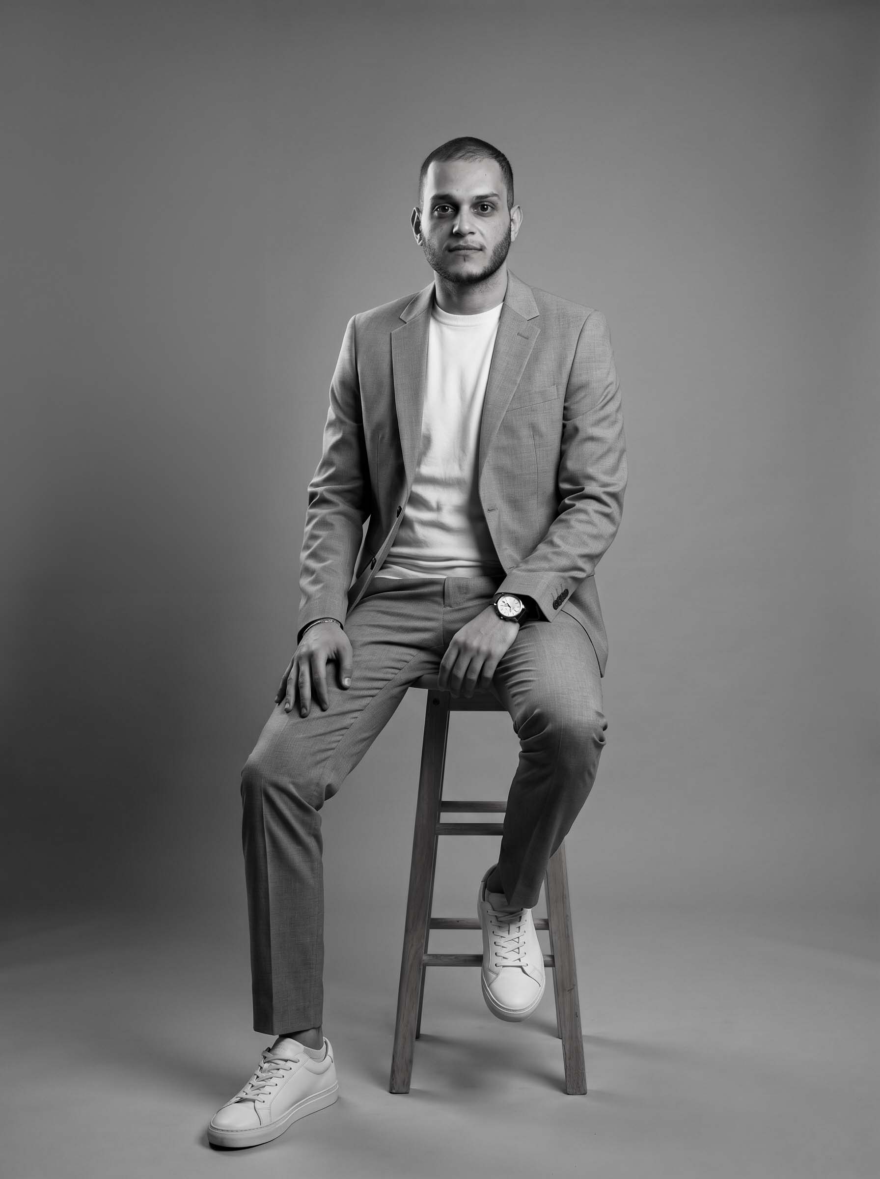 Nawwaf Al Atwani, Production Manager at CREA8 sitting wide shot