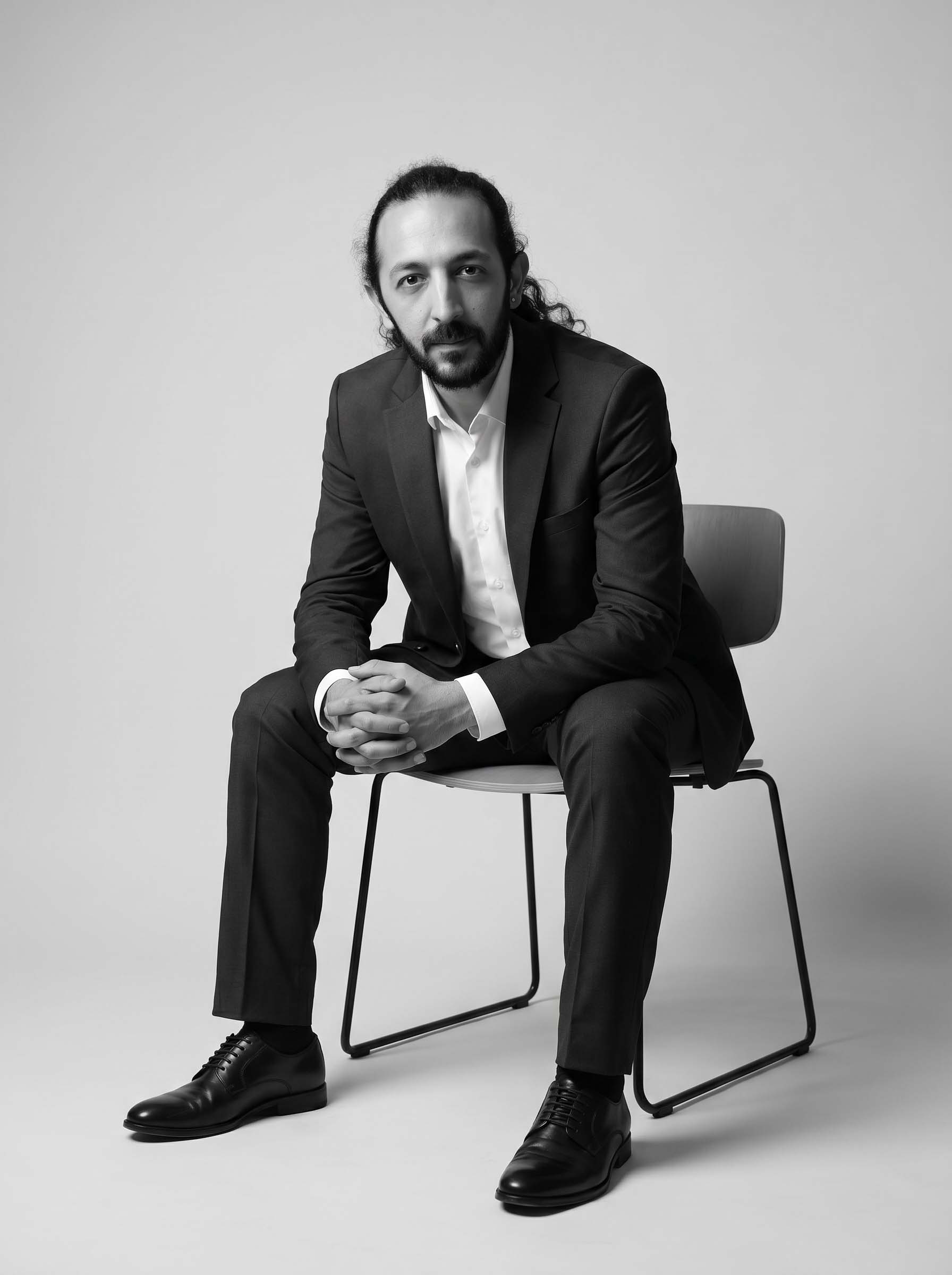Noel Bassil, Creative Director at CREA8 sitting wide shot